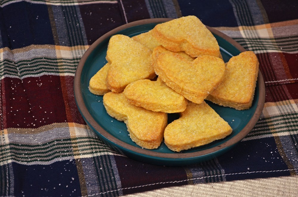 shortbread on a plate with a tartan tea towel